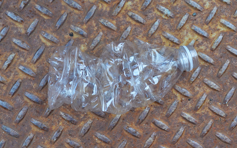 Image of a crushed plastic water bottle