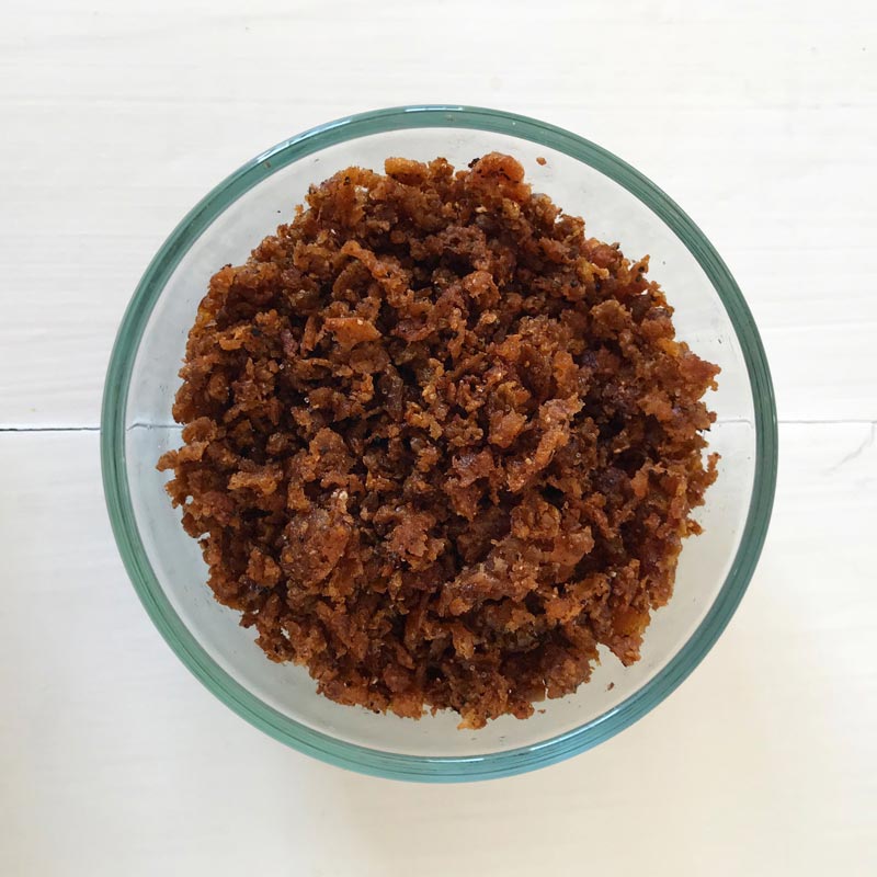 Image of a glass bowl of Beyond Meat Bacon Bits