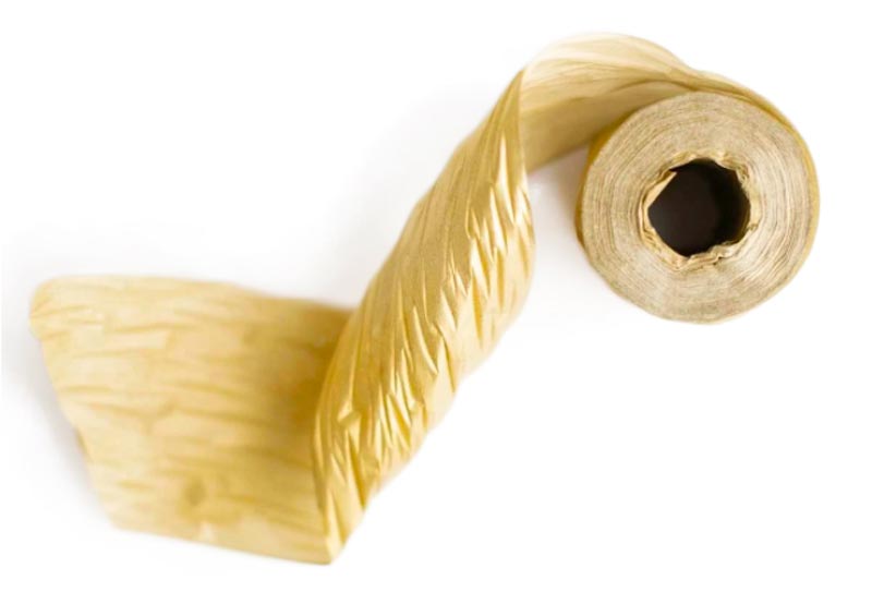 Image of gold paper gift ribbon made out of recycled paper